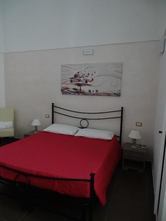 Postel nebo postele na pokoji v ubytování Nonna Ia B&B