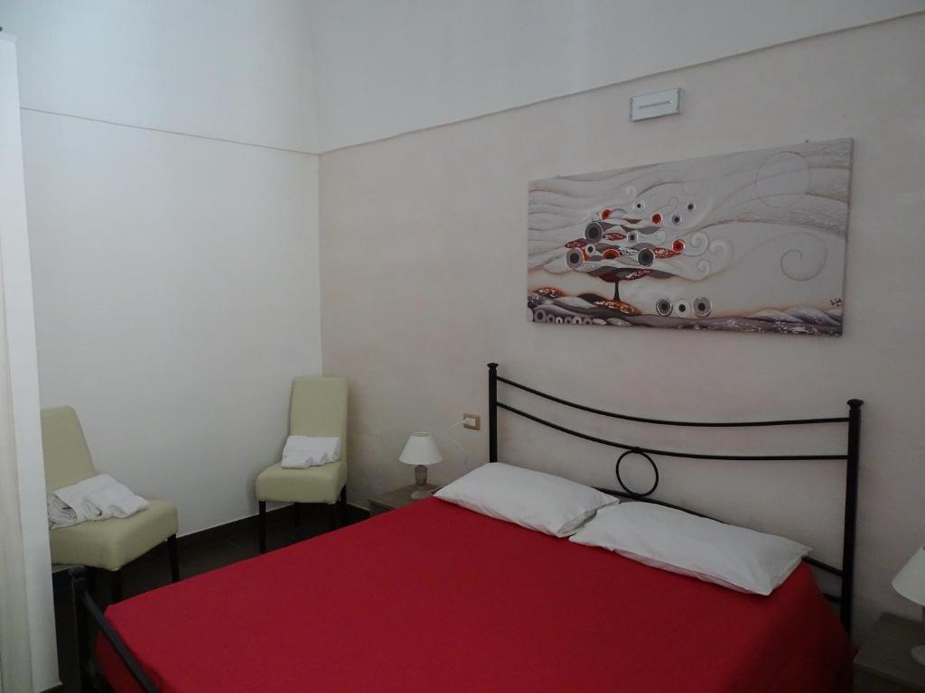 Postel nebo postele na pokoji v ubytování Nonna Ia B&B