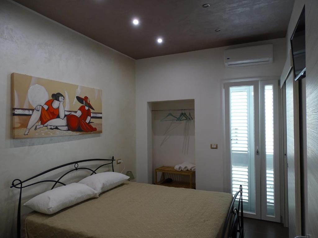 Postel nebo postele na pokoji v ubytování Nonna Ia B&B