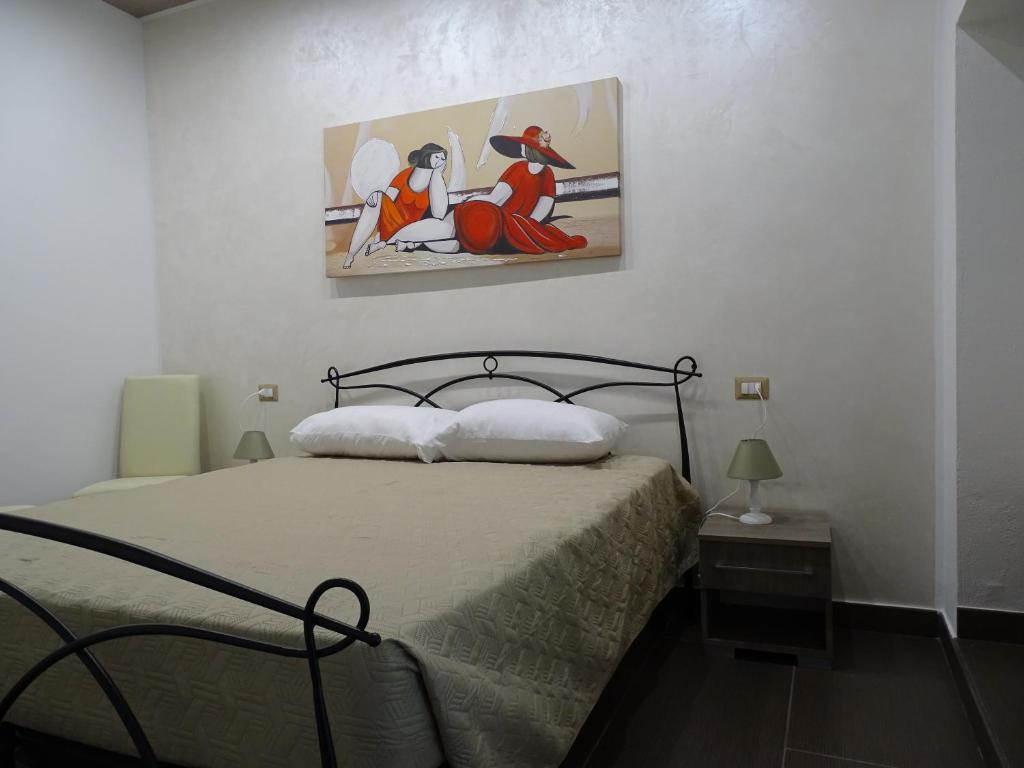 Postel nebo postele na pokoji v ubytování Nonna Ia B&B