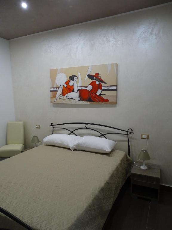 Postel nebo postele na pokoji v ubytování Nonna Ia B&B