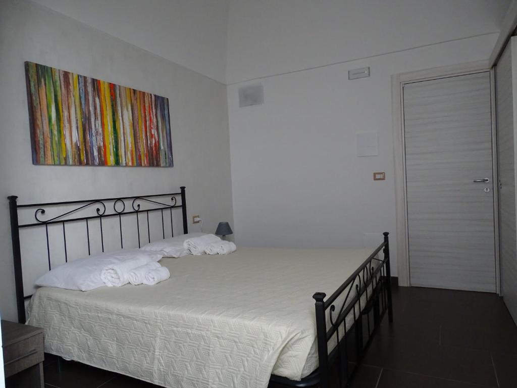 Postel nebo postele na pokoji v ubytování Nonna Ia B&B