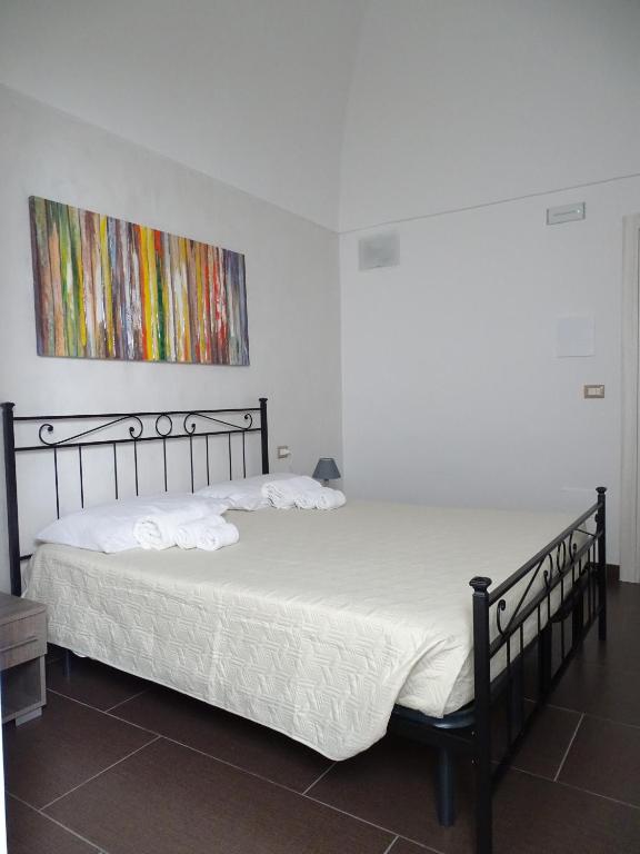 Postel nebo postele na pokoji v ubytování Nonna Ia B&B