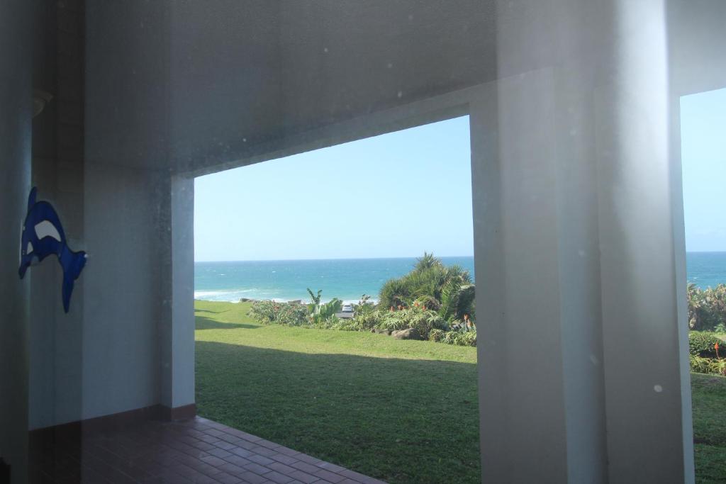 an open door to a room with a view of the ocean at Laguna La Crete 4 in Margate