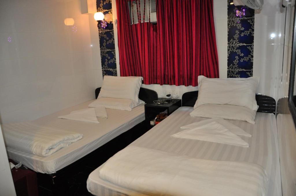 Postel nebo postele na pokoji v ubytování Swiss Hostel