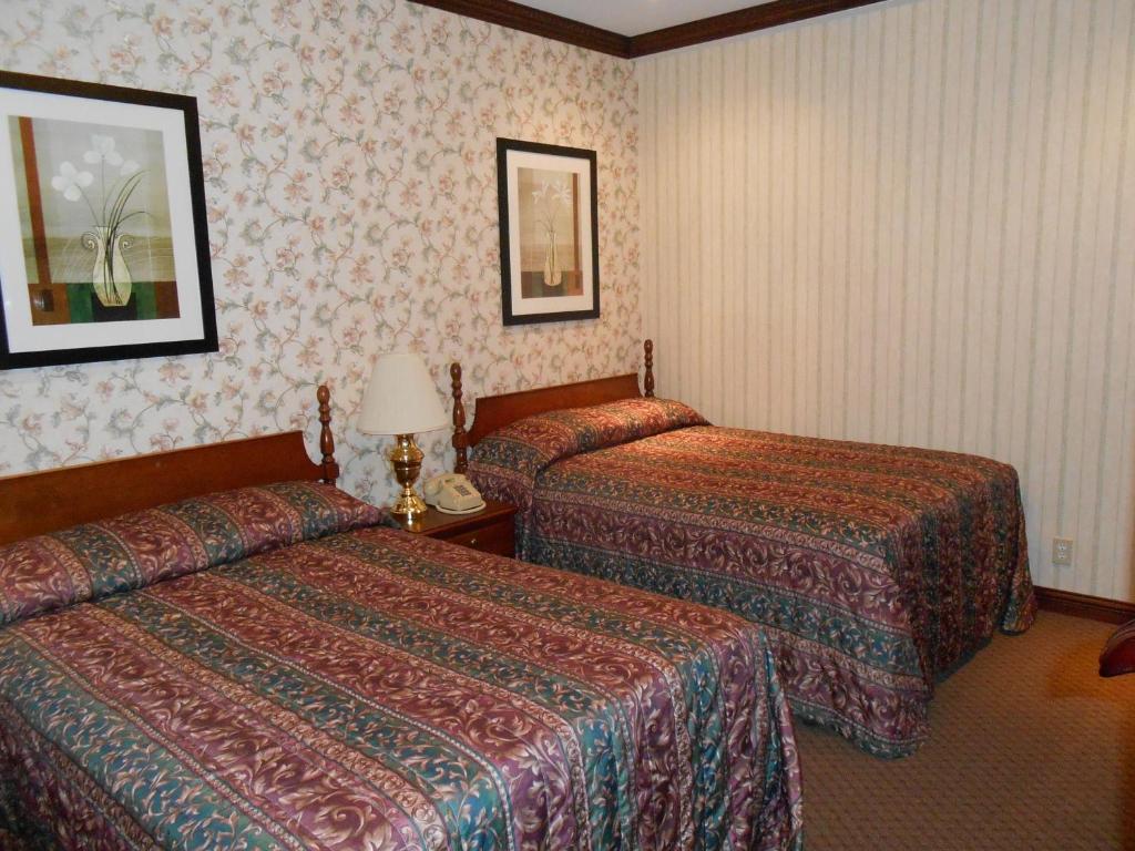 Postel nebo postele na pokoji v ubytování Hotel 31 Extended Stay