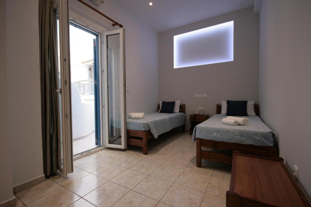 Postel nebo postele na pokoji v ubytování Hotel Zeus