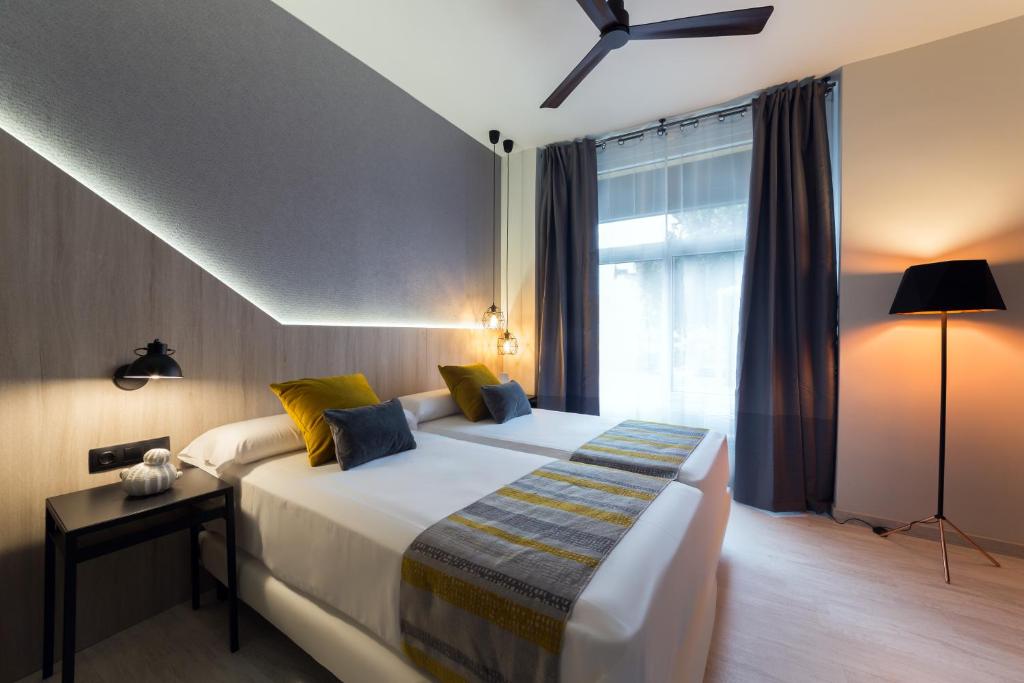 Postel nebo postele na pokoji v ubytování Hotel Onyarbi