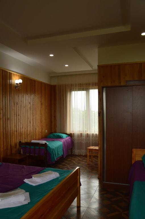Postel nebo postele na pokoji v ubytování Kobuleti Pines Resort