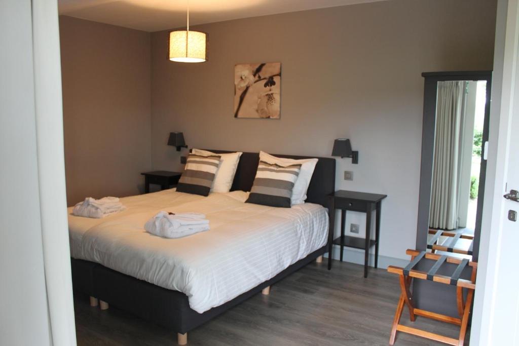 Postel nebo postele na pokoji v ubytování B&B de Rijcke Rust
