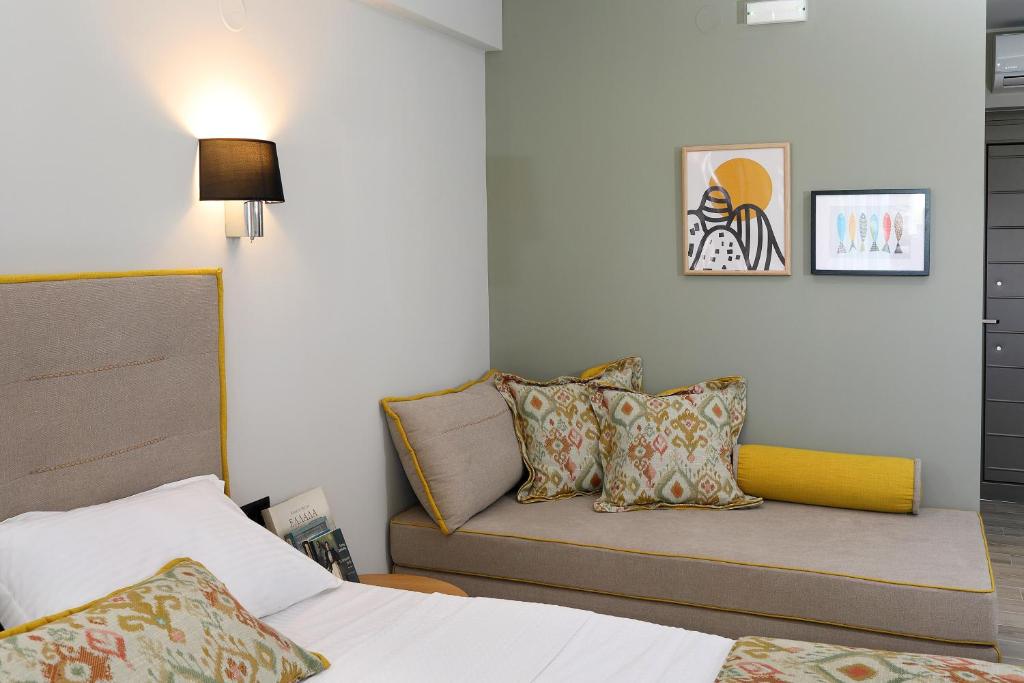 Postel nebo postele na pokoji v ubytování Kallini Apartments