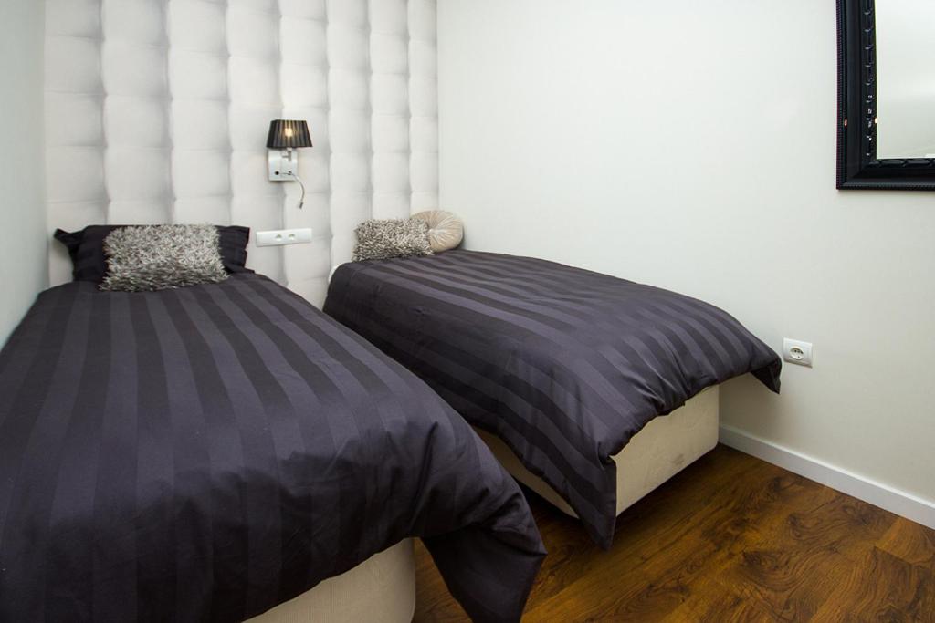 A bed or beds in a room at Total Valencia Elegance