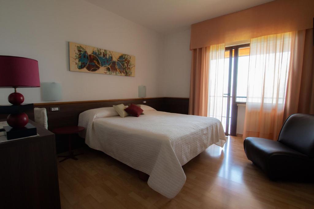 Postel nebo postele na pokoji v ubytování Hotel San Zeno