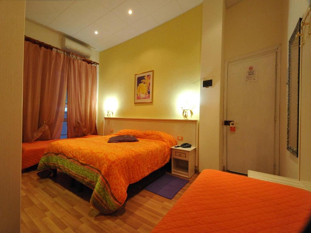 Postel nebo postele na pokoji v ubytování Hotel Alexander & Spa