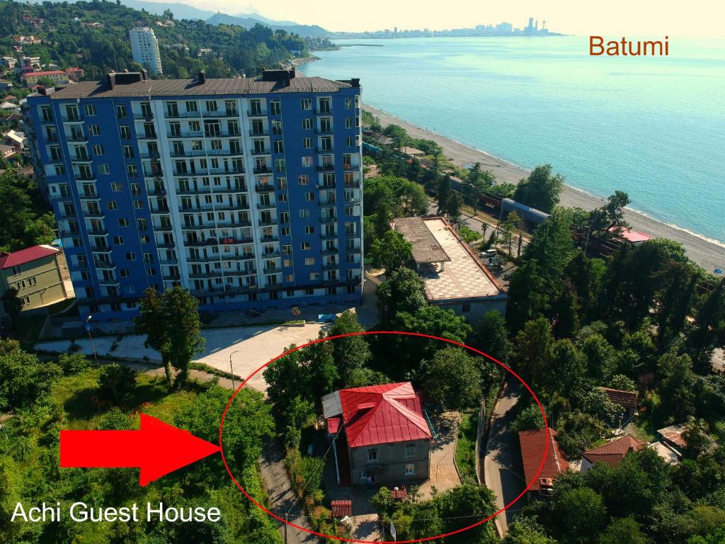 an aerial view of an apartment building with a red arrow at Achi Guest House in Makhinjauri