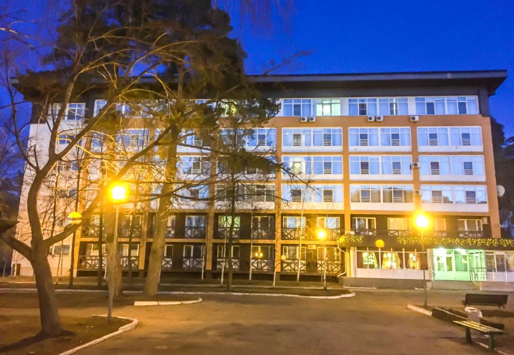 a large building with a lot of windows at night at Sanotoriy Solotcha in Solotcha