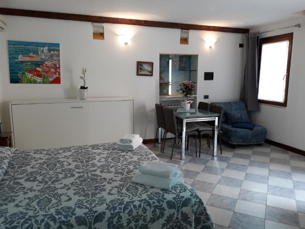 Postel nebo postele na pokoji v ubytování mini loft galeazze