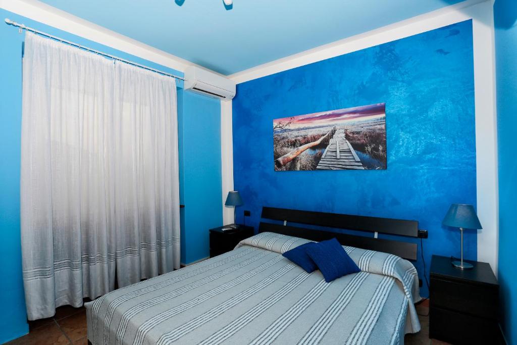 Postel nebo postele na pokoji v ubytování Casa Vacanze La Nautica