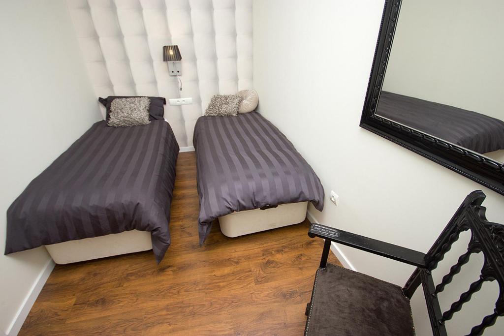 A bed or beds in a room at Total Valencia Elegance