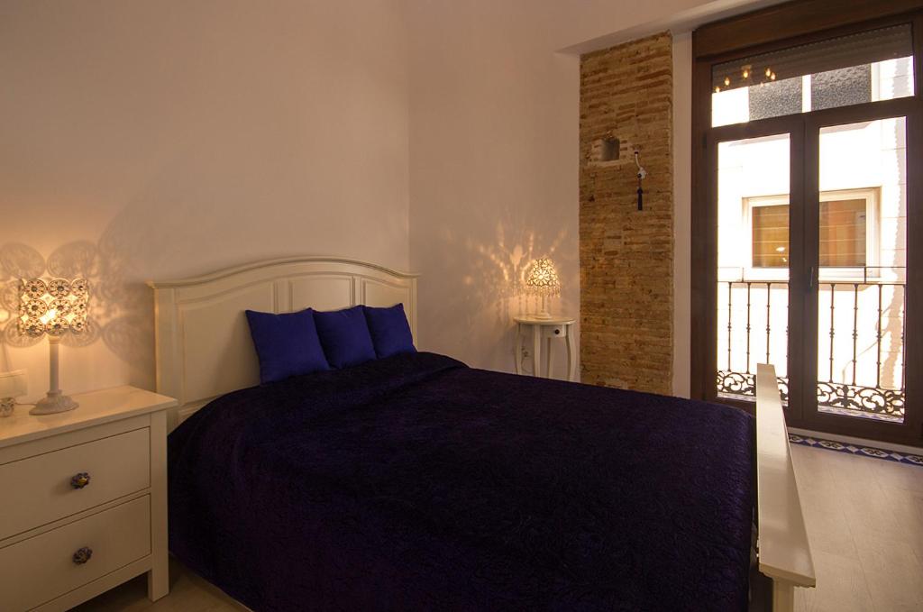 A bed or beds in a room at Total Valencia Elegance