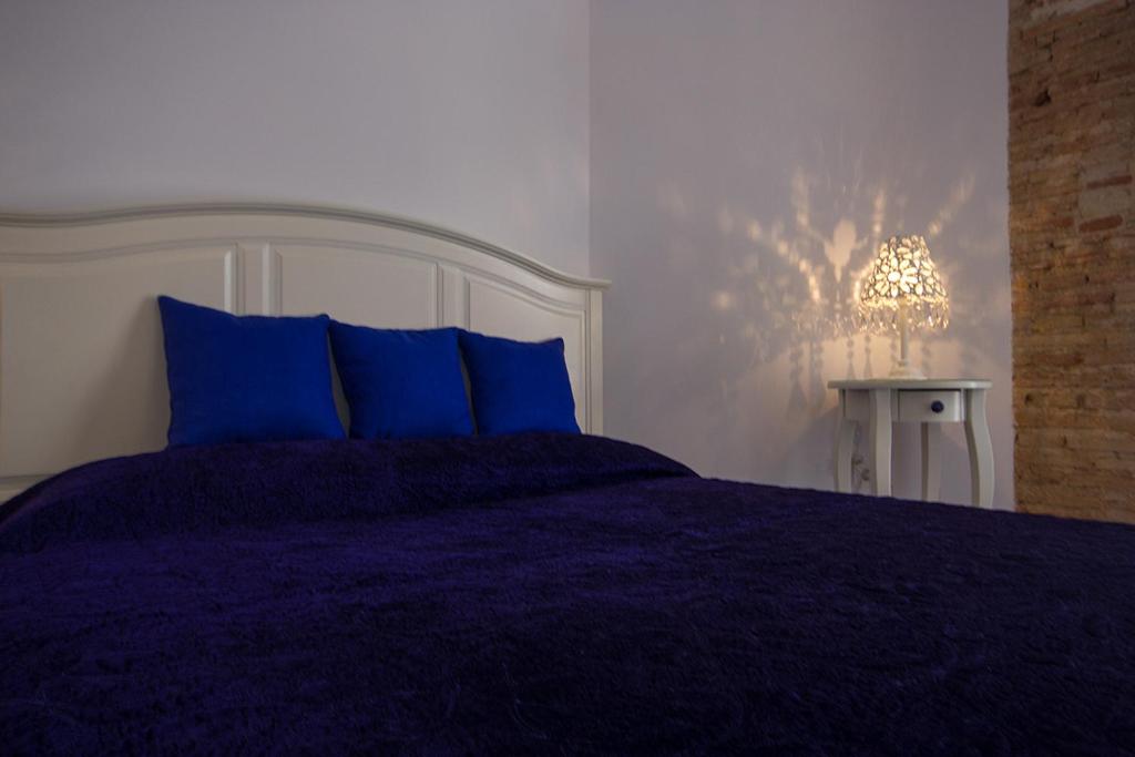 A bed or beds in a room at Total Valencia Elegance