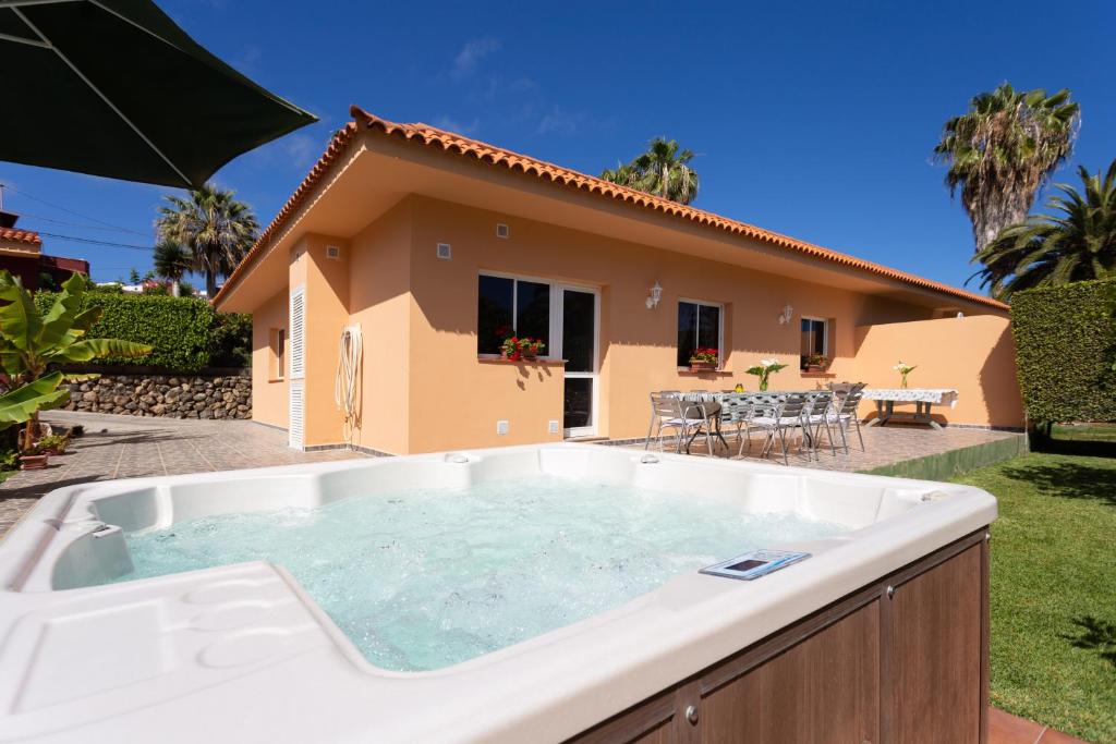 a large hot tub in front of a house at Finca La Gaviota - Los Limoneros- Jacuzzi Privado in Icod de los Vinos