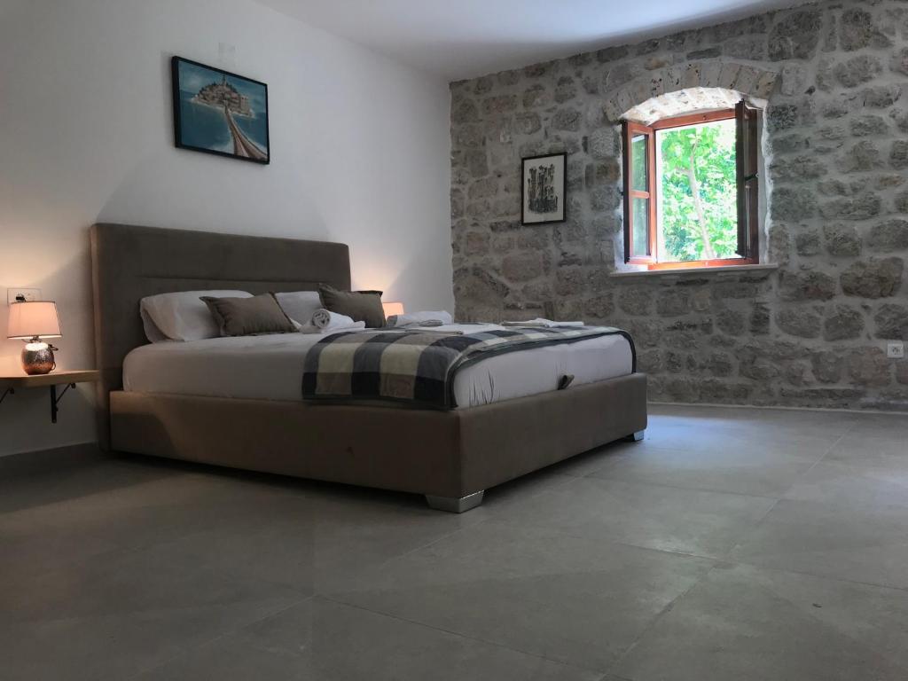 Postel nebo postele na pokoji v ubytování Stone house 264