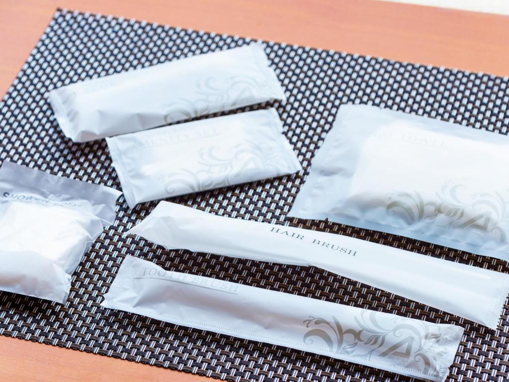 a group of white napkins sitting on a table at Hotel Abest Naha Kokusaidori in Naha
