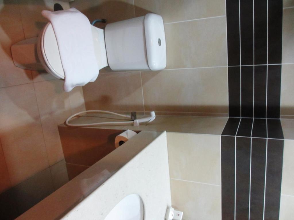 Koupelna v ubytování Sanbay Hotel