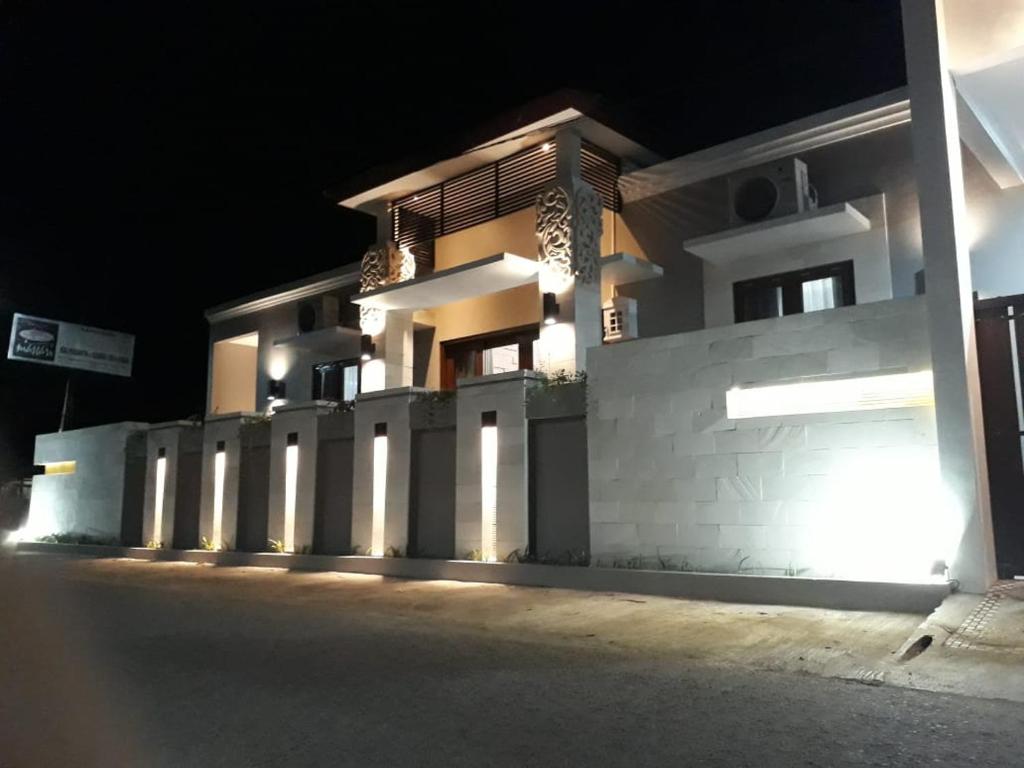 a building at night with its lights on at Imperial Villa Syariah in Yogyakarta