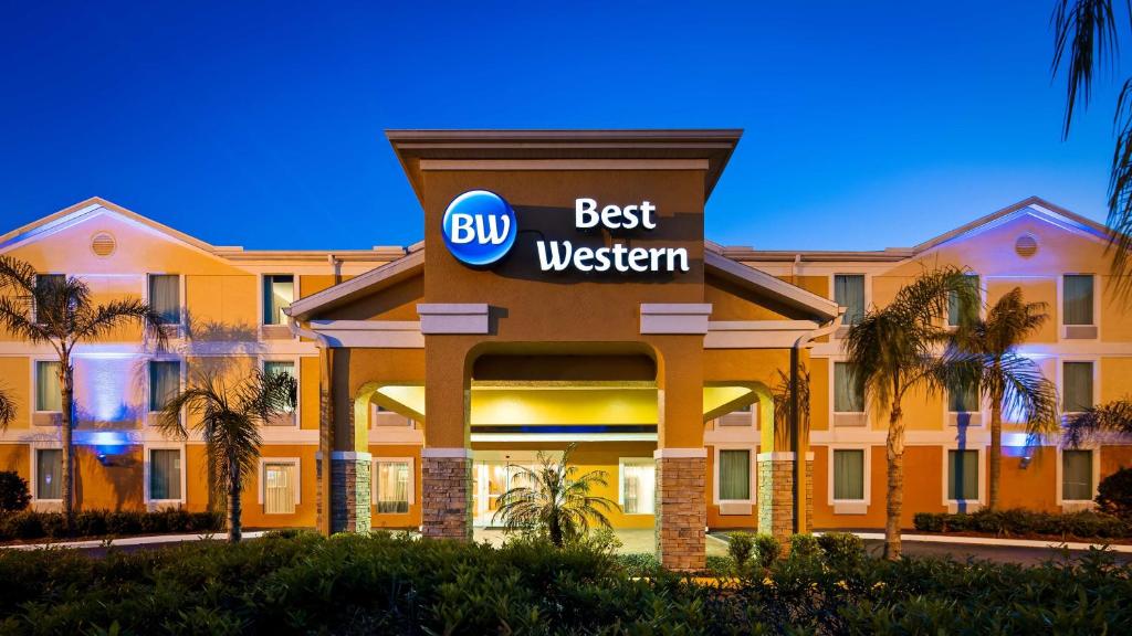 a hotel with a sign that reads best western at Best Western Wesley Chapel in Wesley Chapel