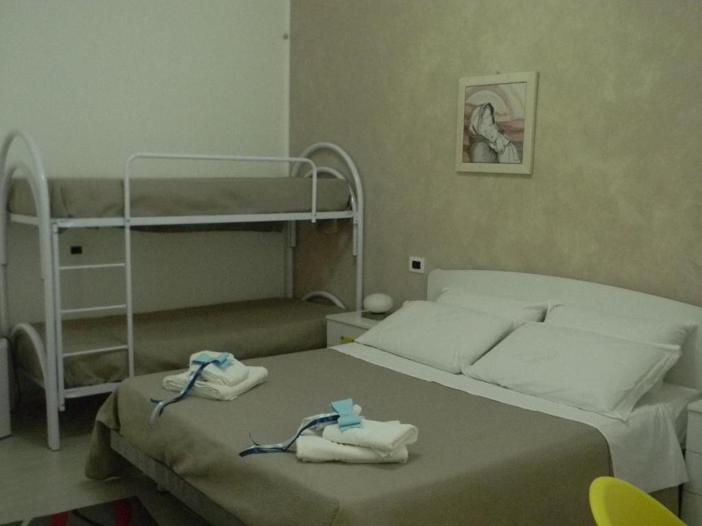 Postel nebo postele na pokoji v ubytování B&B Giorgio La Pira