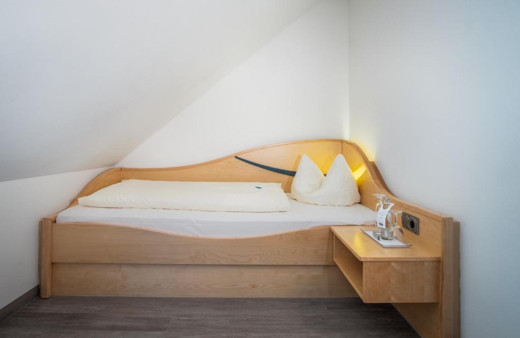 Postel nebo postele na pokoji v ubytování Hotel Atrium Garni