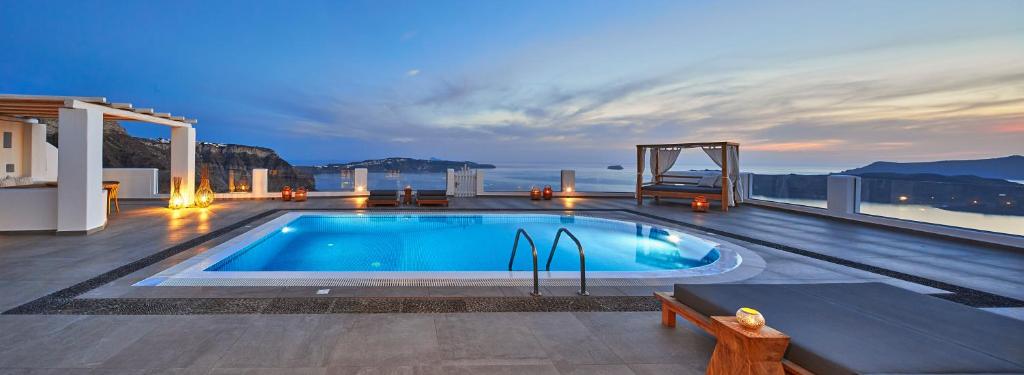 a swimming pool on the roof of a house at Celestia Grand in Fira