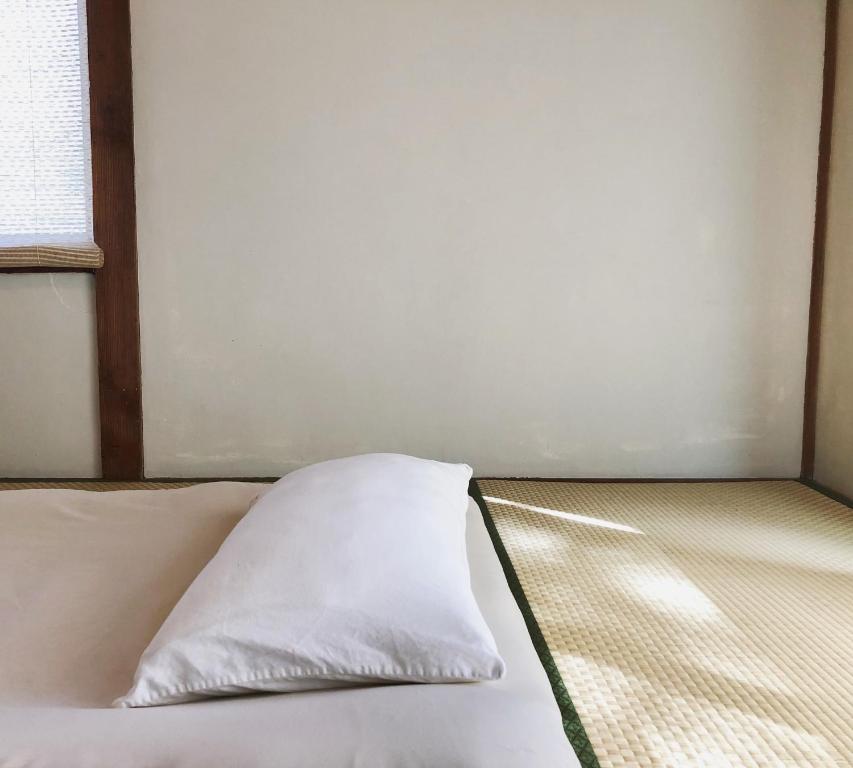 Postel nebo postele na pokoji v ubytování Hostel Fuji Matsuyama Base