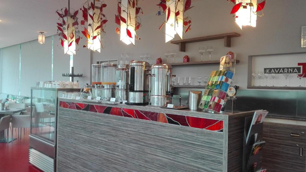 Příslušenství pro přípravu čaje a kávy v ubytování Hotel Olympia