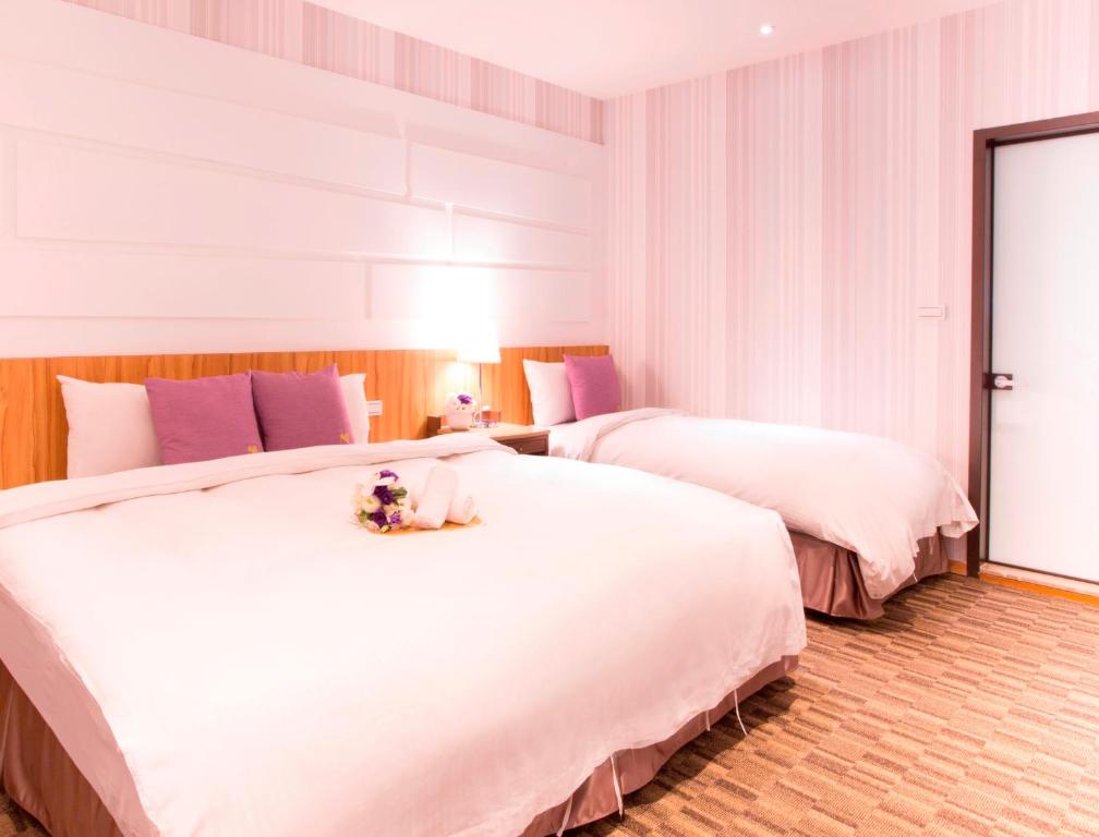 Postel nebo postele na pokoji v ubytování Muzik Hotel - Ximending Xining Branch