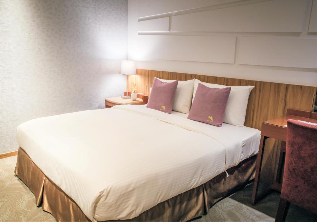 Postel nebo postele na pokoji v ubytování Muzik Hotel - Ximending Xining Branch