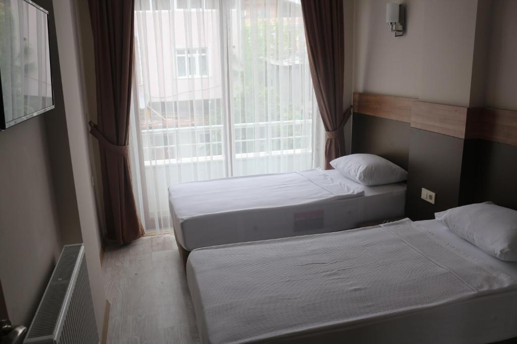 Longoz Hotel - Habitación Cuádruple