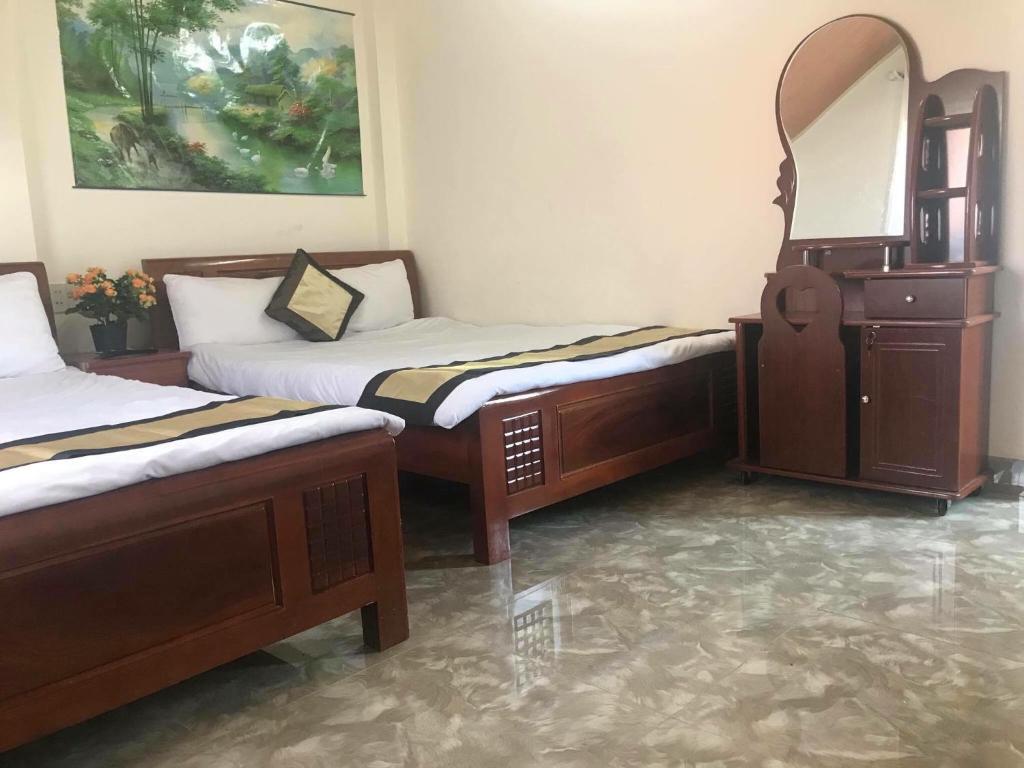 Ένα ή περισσότερα κρεβάτια σε δωμάτιο στο Thu Linh Guesthouse