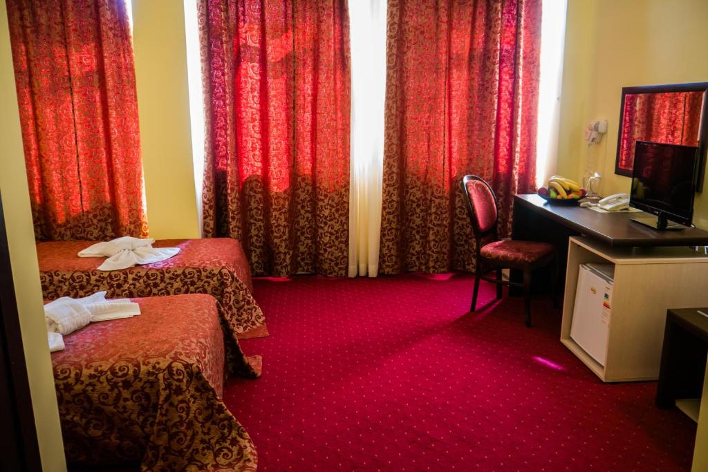 Postel nebo postele na pokoji v ubytování Hotel Kabile