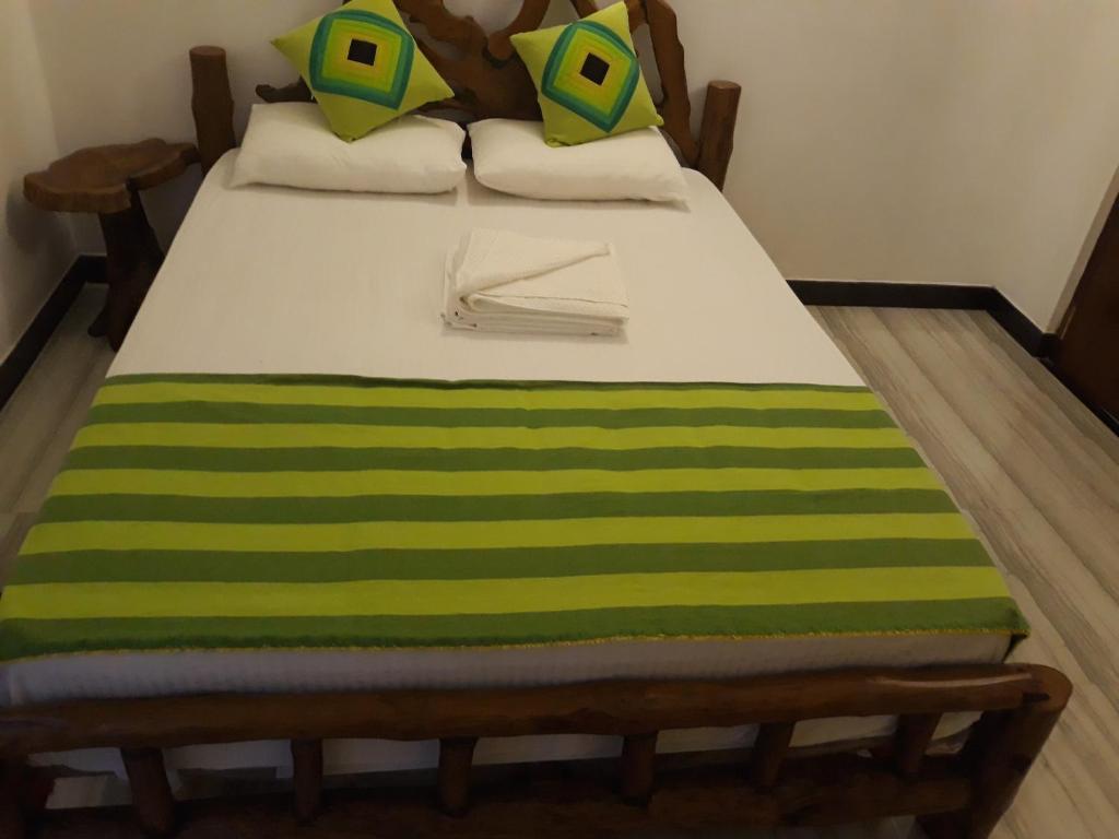 Postel nebo postele na pokoji v ubytování Hewage Resort