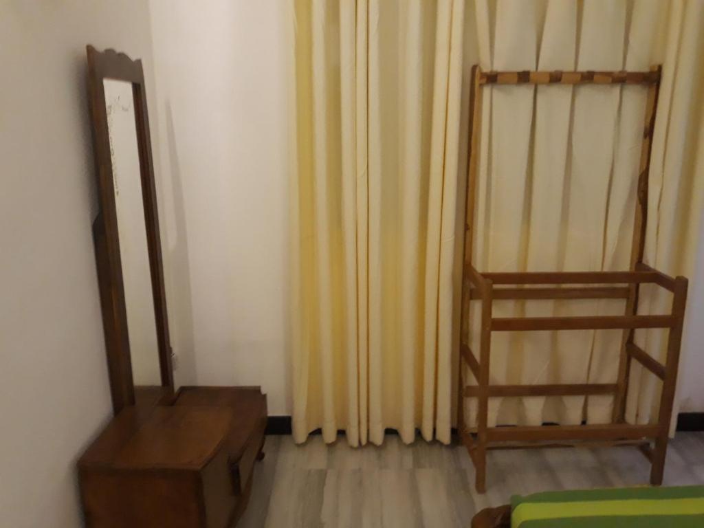Postel nebo postele na pokoji v ubytování Hewage Resort