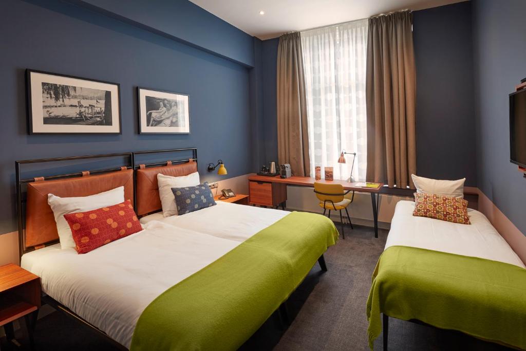 Postel nebo postele na pokoji v ubytování Hotel Lion D'Or
