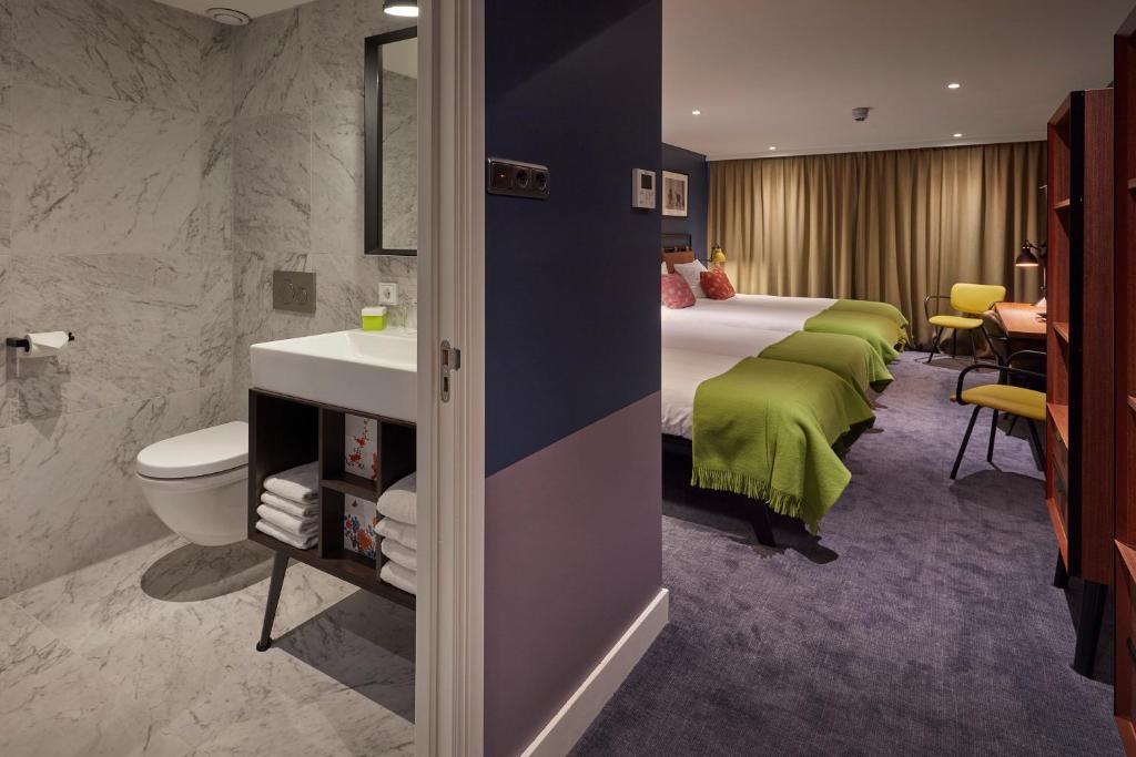 Postel nebo postele na pokoji v ubytování Hotel Lion D'Or