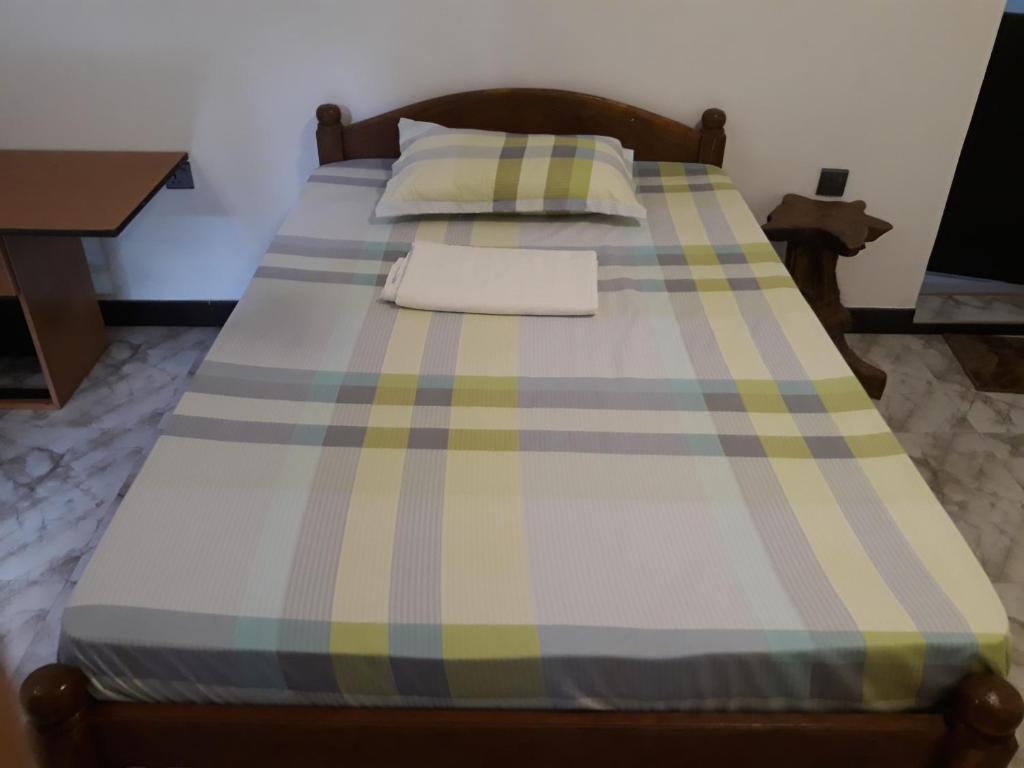 Postel nebo postele na pokoji v ubytování Hewage Resort