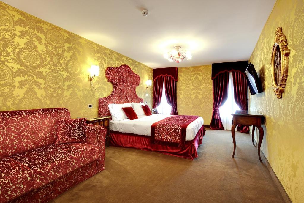 Postel nebo postele na pokoji v ubytování Hotel Casanova