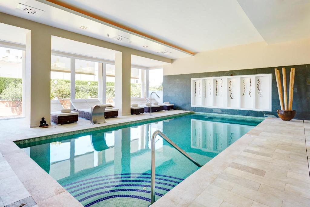 The swimming pool at or close to Grupotel Macarella Suites & Spa