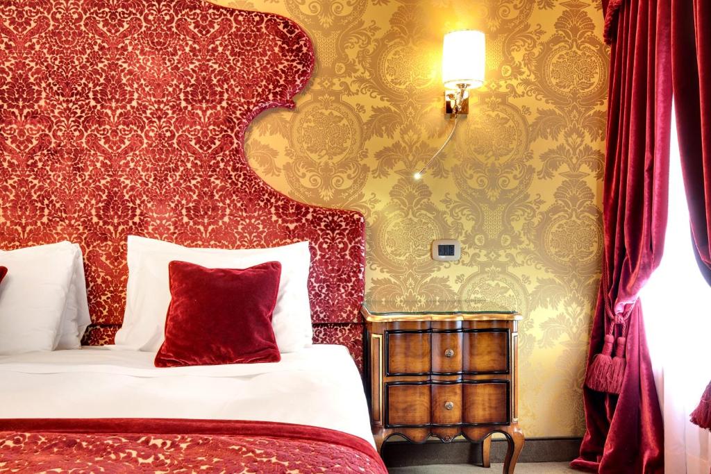 Postel nebo postele na pokoji v ubytování Hotel Casanova