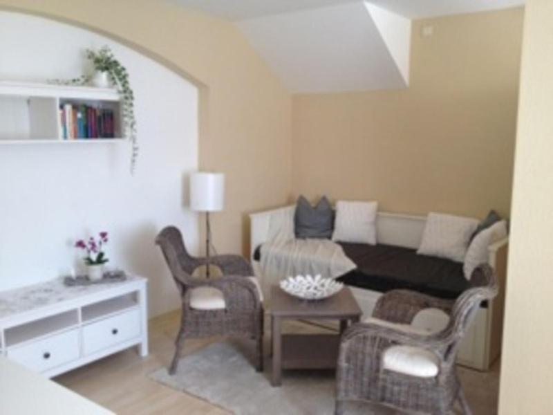 a living room with a couch and chairs and a table at Ferienwohnung Eckloff in Lutherstadt Wittenberg